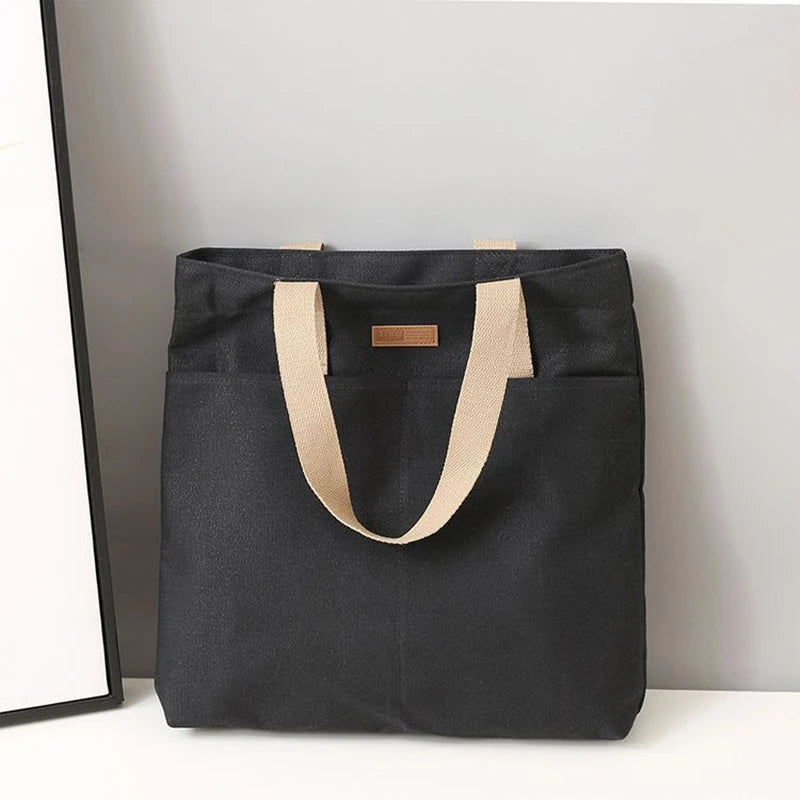 “Women’s solid color canvas tote bag, large capacity, casual, reusable, beach shopping.”