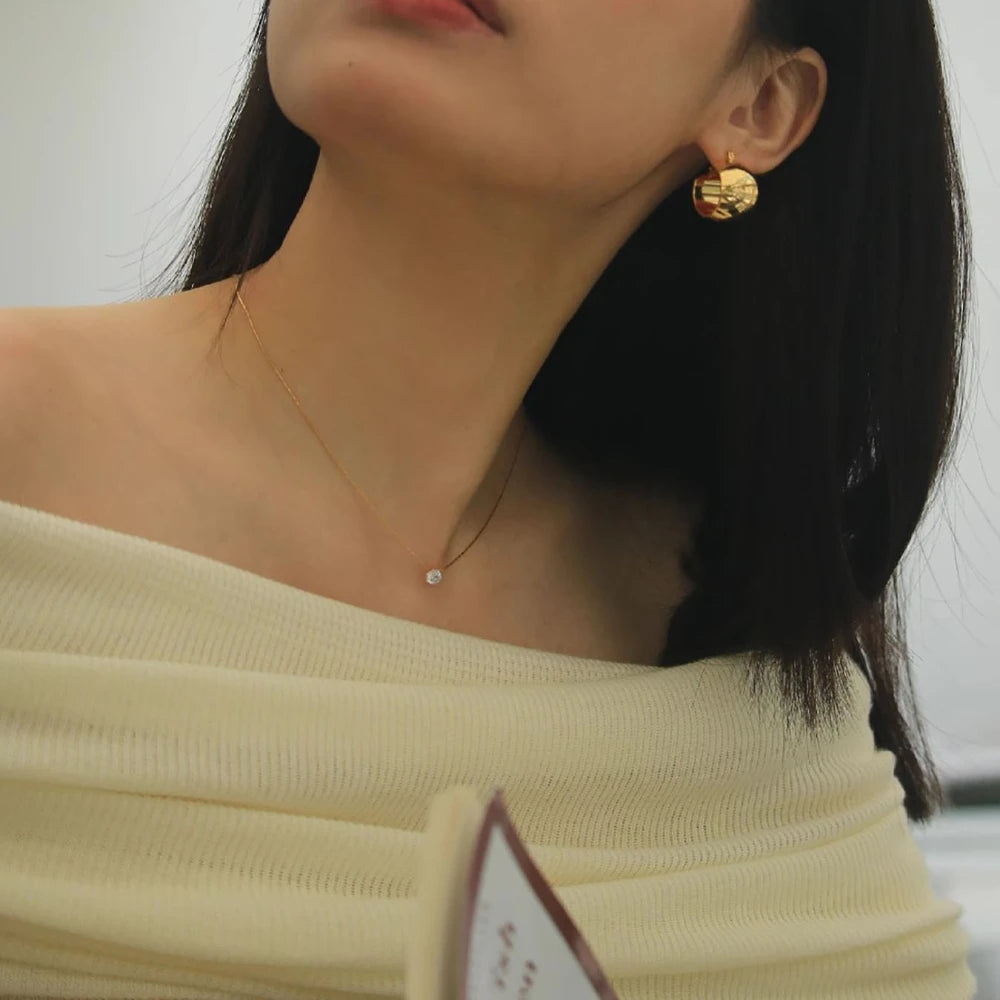“Stainless Steel Gold Plated Zircon Necklace - Dainty Minimalist Clear CZ Charm for Women.”