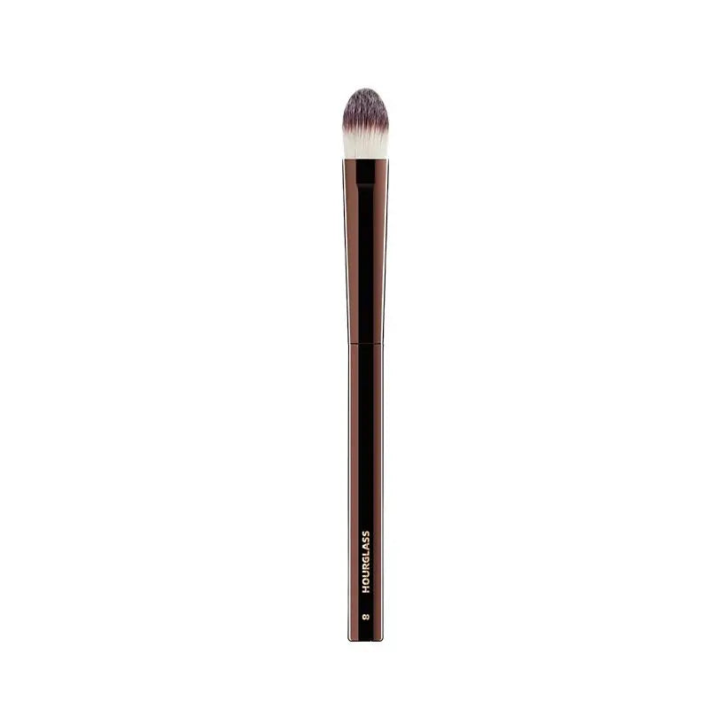 “Large concealer brush, soft fiber hair, flawless coverage, stylish makeup tool.”