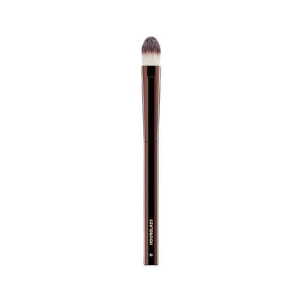 “Large concealer brush, soft fiber hair, flawless coverage, stylish makeup tool.”