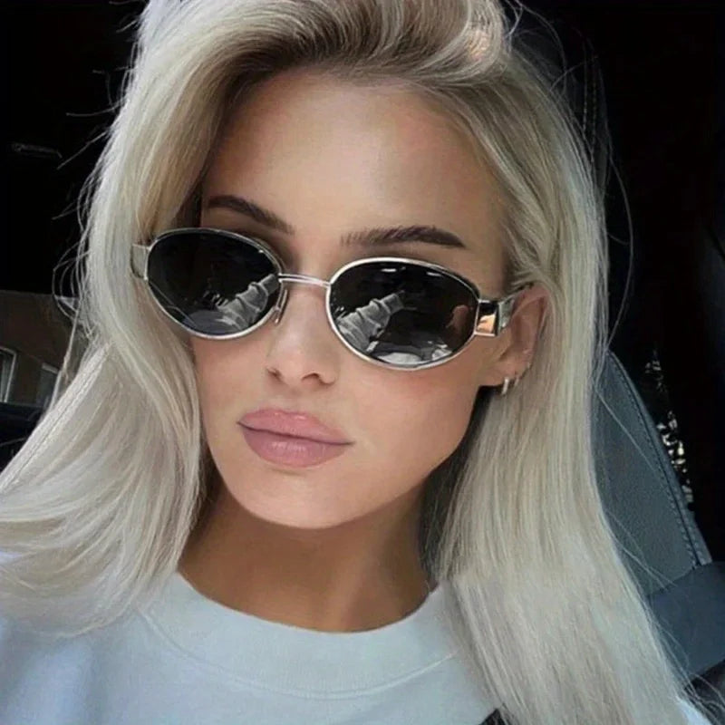 “Oval sunglasses with metal frame, trendy unisex design, classic shades.”