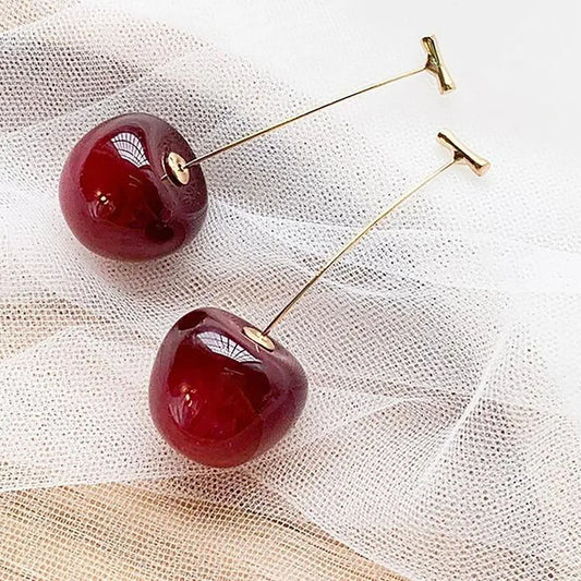 “Red cherry dangle earrings, fruit design, statement jewelry, perfect for parties.”
