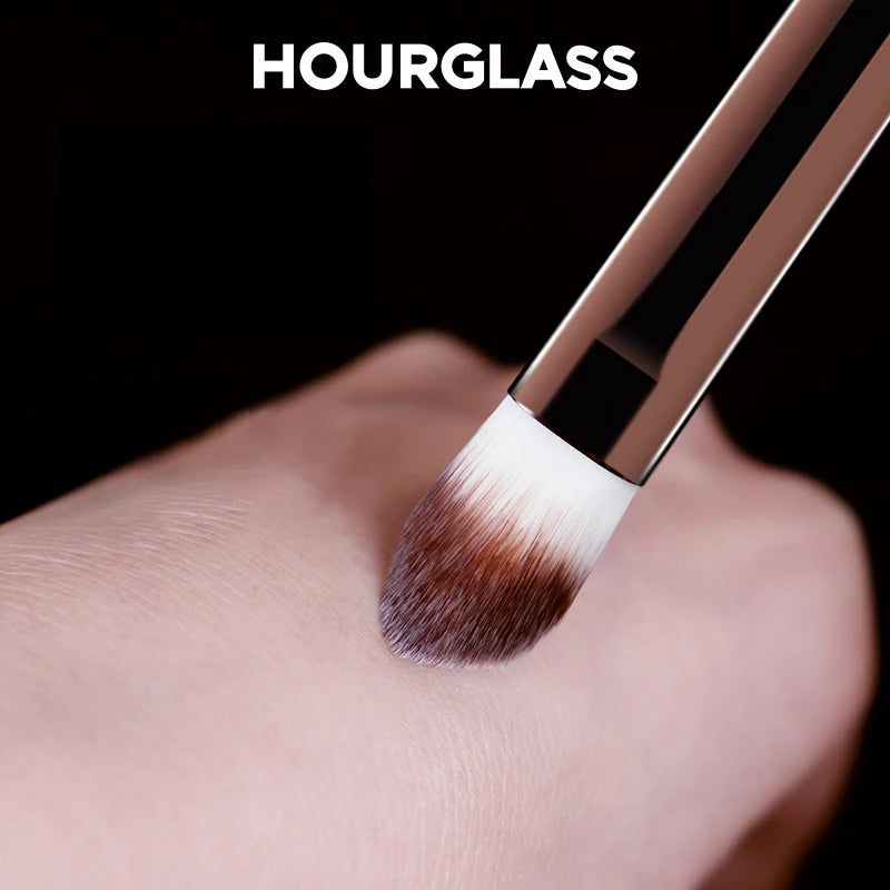 “Large concealer brush, soft fiber hair, flawless coverage, stylish makeup tool.”