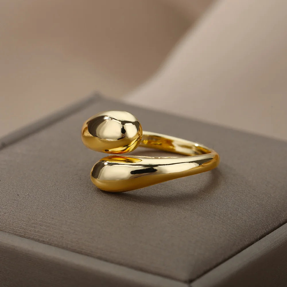 “Trendy Gold Stainless Steel Rings for Women - Perfect Wedding & Couple Jewelry.”