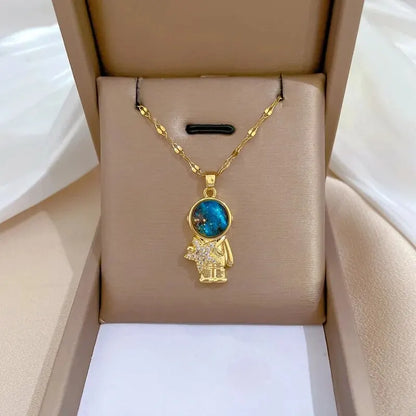 “Luxury gold titanium steel necklace with planet, moon, astronaut pendants.”