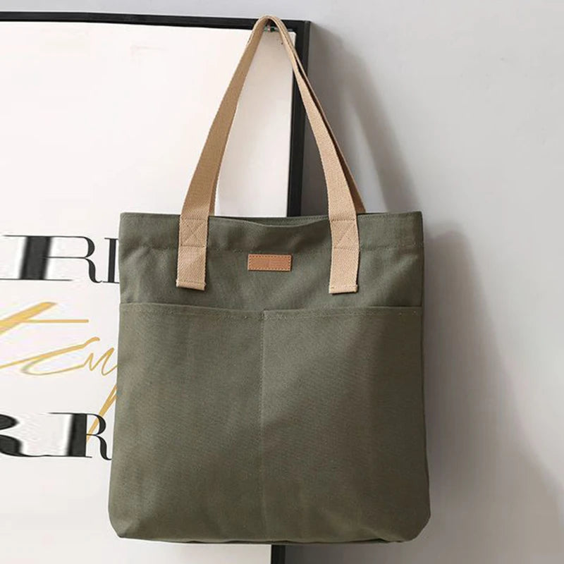 “Women’s solid color canvas tote bag, large capacity, casual, reusable, beach shopping.”