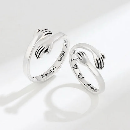 “Romantic Heart Hand Hug Ring - Adjustable Couple Ring for Wedding & Dating.”