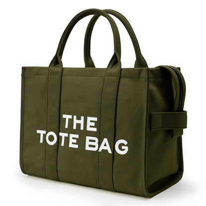 “Designer canvas tote bag, large capacity, adjustable shoulder strap, crossbody style.”