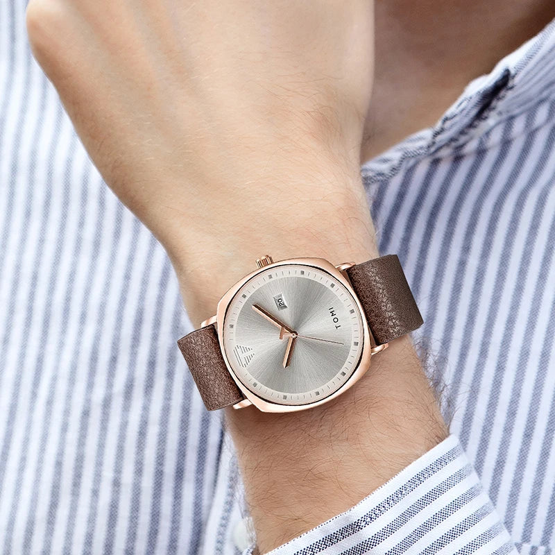 “Minimalist men’s sports watch with calendar, leather strap, casual quartz movement.”
