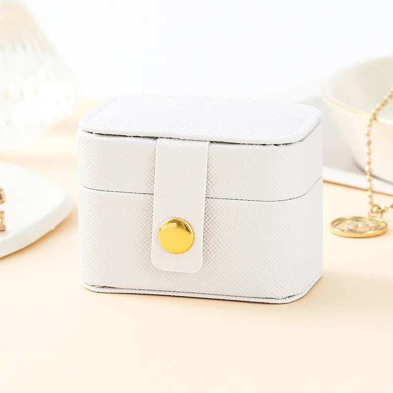 “Mini Portable Jewelry Storage Bag Leather Travel Box for Rings, Necklaces, Earrings.”