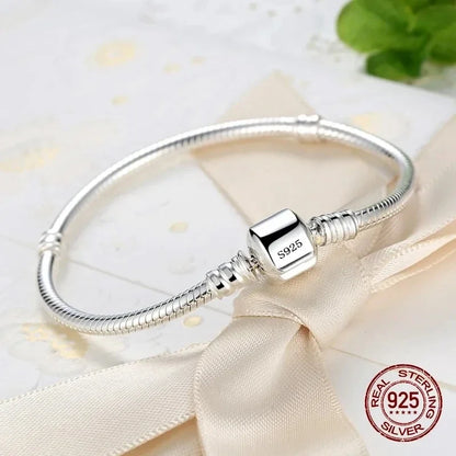 “Luxury Handmade 925 Sterling Silver Charm Bracelet - Smooth Snake Bone Design.”