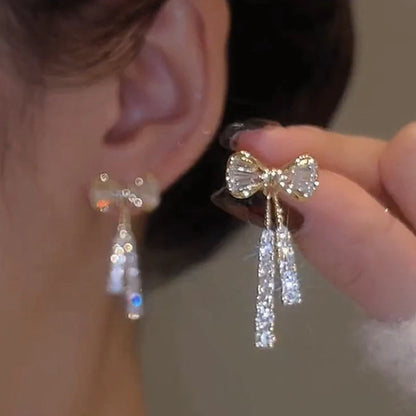“Gold Bow Stud Earrings for Women - Dainty Rhinestone Jewelry.”