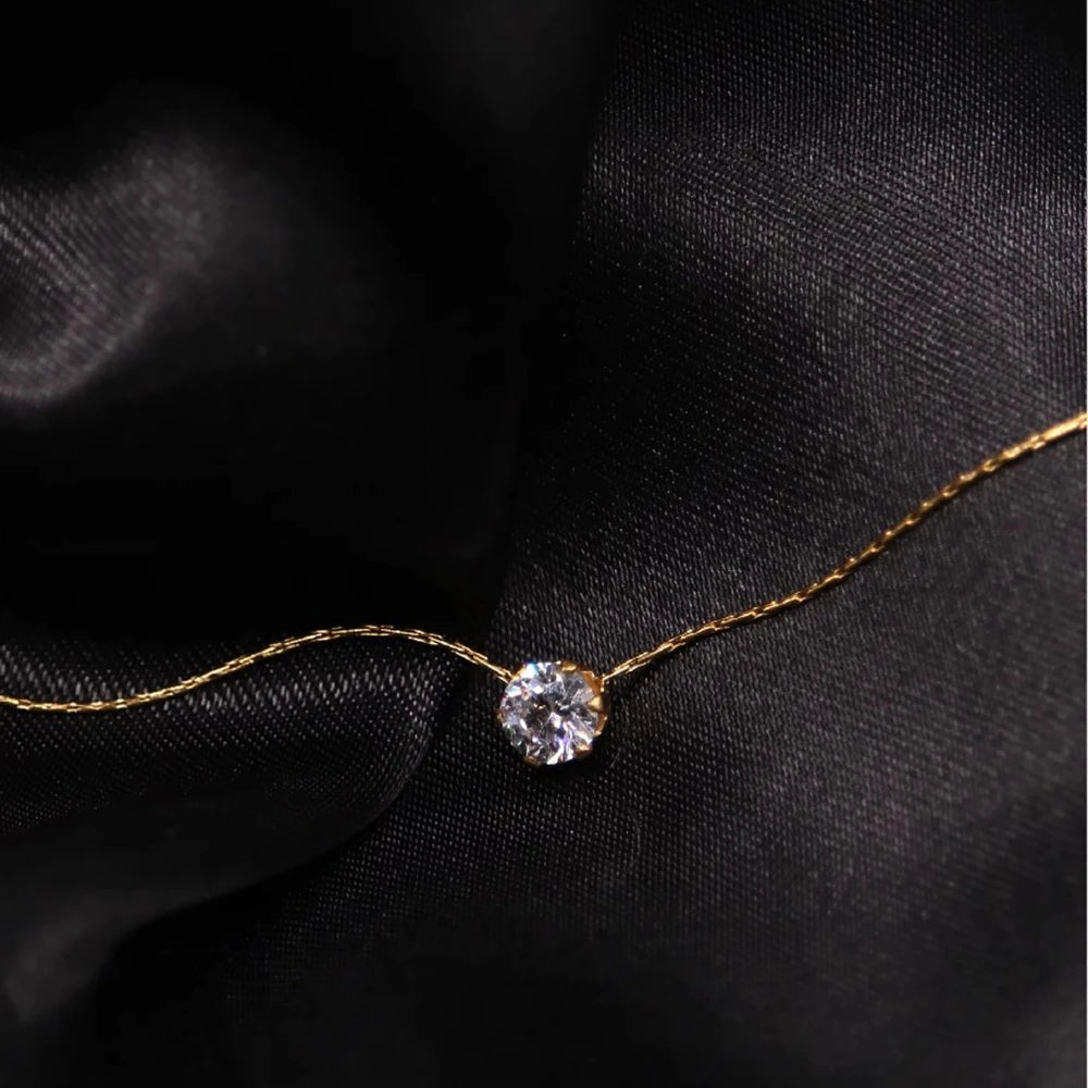 “Stainless Steel Gold Plated Zircon Necklace - Dainty Minimalist Clear CZ Charm for Women.”