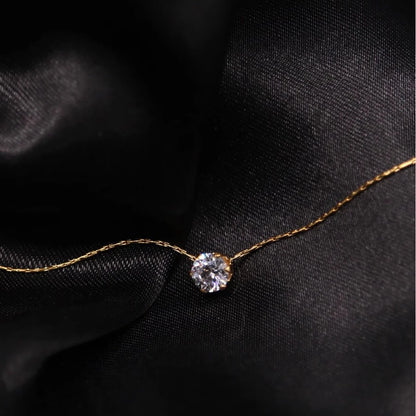“Stainless Steel Gold Plated Zircon Necklace - Dainty Minimalist Clear CZ Charm for Women.”