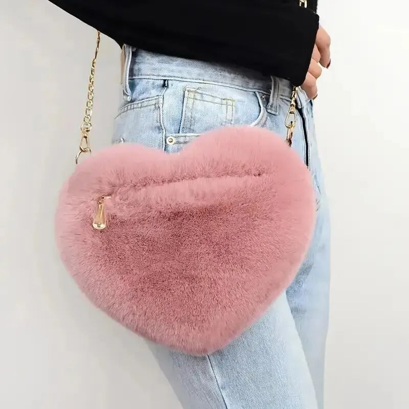 “Heart-shaped fluffy handbag, chain crossbody, cute zipper, perfect for Valentine’s Day.”