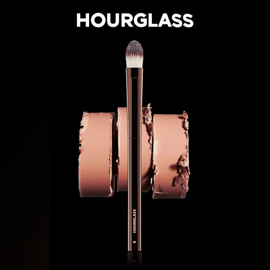 “Large concealer brush, soft fiber hair, flawless coverage, stylish makeup tool.”