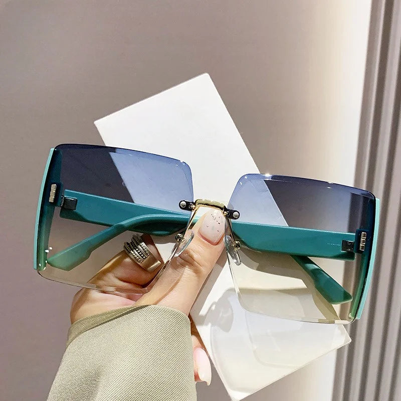 “Fashion rimless women’s sunglasses, gradient lenses, retro UV400 beach style.”