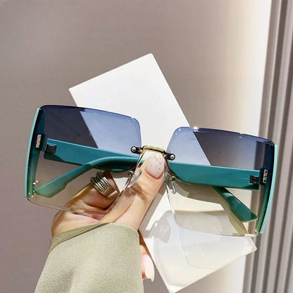 “Fashion rimless women’s sunglasses, gradient lenses, retro UV400 beach style.”