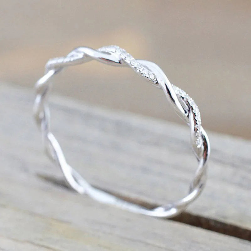 “Huitan Simple Stylish Thin Rings - Twist Band with Shiny CZ for Daily Wear.”