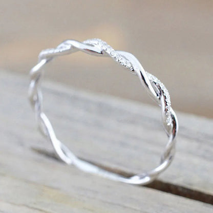 “Huitan Simple Stylish Thin Rings - Twist Band with Shiny CZ for Daily Wear.”