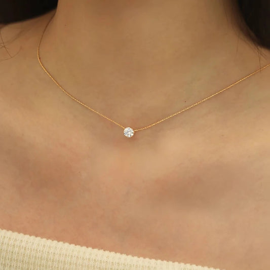 “Stainless Steel Gold Plated Zircon Necklace - Dainty Minimalist Clear CZ Charm for Women.”
