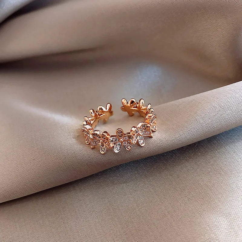 “Luxury Zircon Flower Rings for Women - Rose, Cherry Blossom, Tulip Design, Adjustable.”
