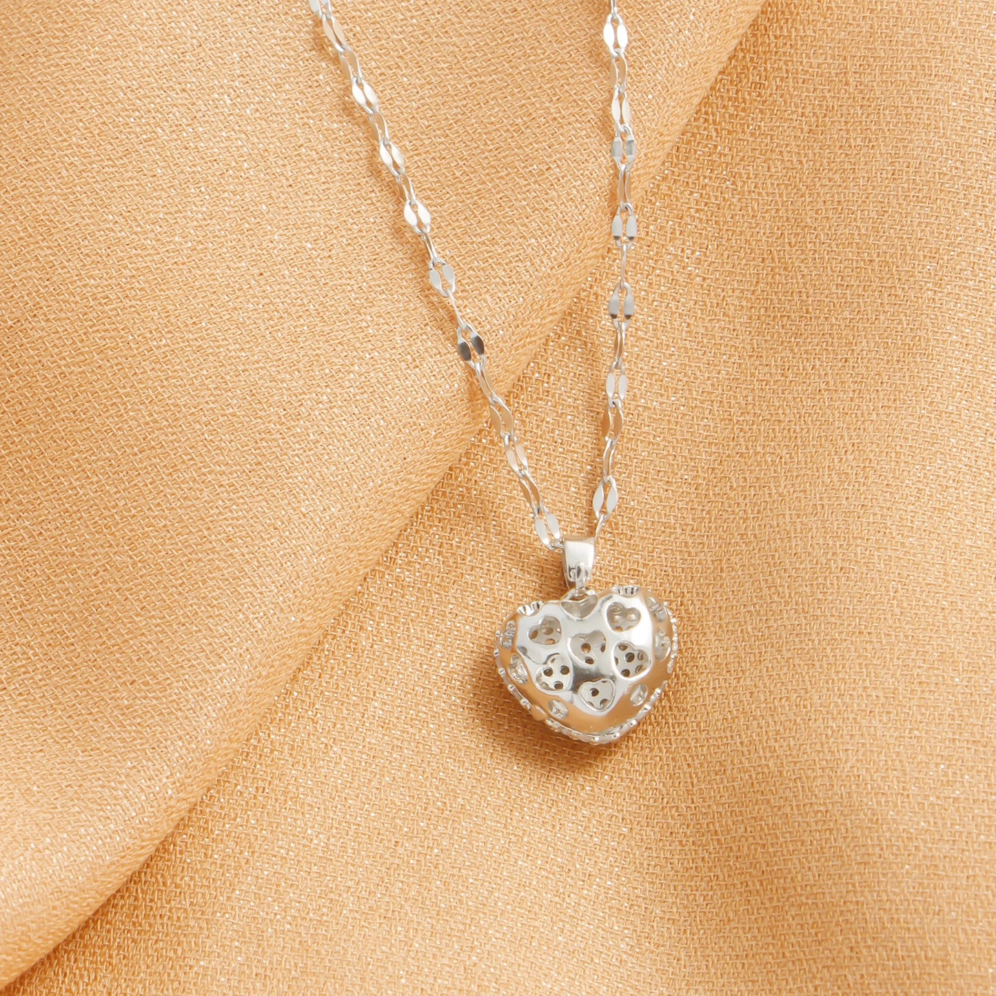 “Cubic Zirconia Heart Pendant Necklace - Gold-Plated Stainless Steel for Women.”