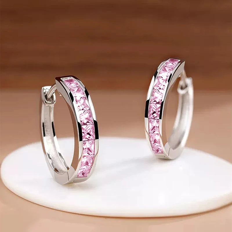 “Classic hoop earrings with princess-cut CZ, elegant and versatile women’s accessories.”