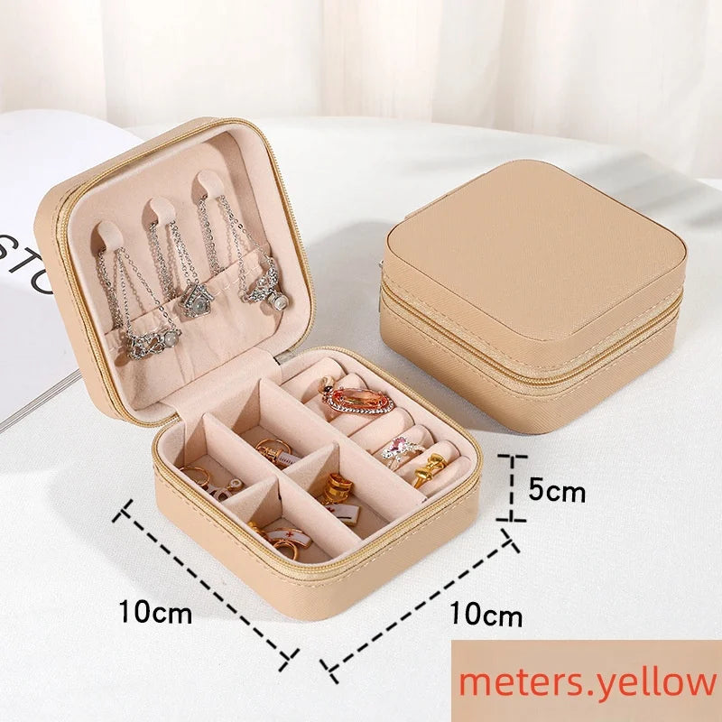 “Portable mini jewelry storage box, PU leather, for earrings, necklaces, rings.”