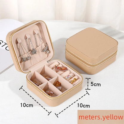 “Portable mini jewelry storage box, PU leather, for earrings, necklaces, rings.”