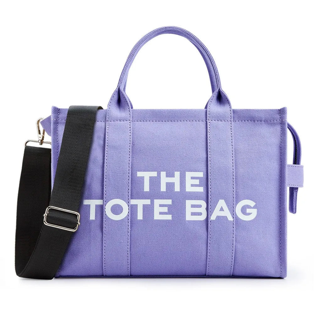 “Designer canvas tote bag, large capacity, adjustable shoulder strap, crossbody style.”