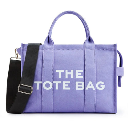 “Designer canvas tote bag, large capacity, adjustable shoulder strap, crossbody style.”