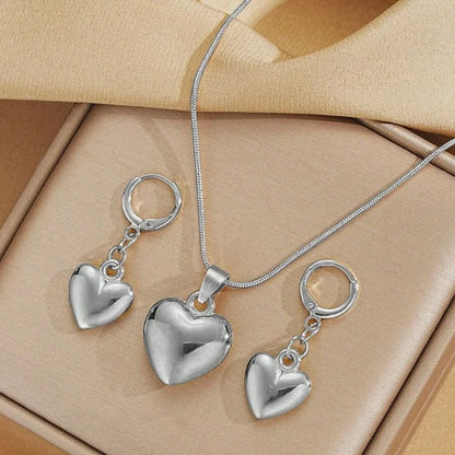 “Glossy Gold-Plated Love Heart Earrings & Necklace Set - Simple Dainty Jewelry for Women.”