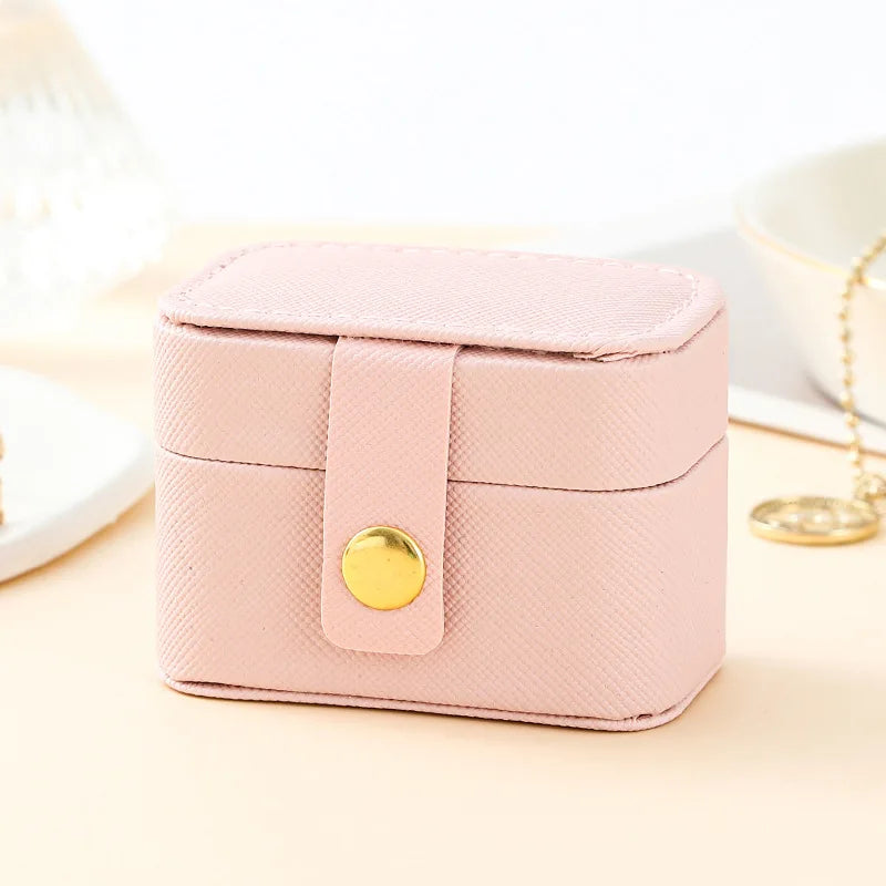 “Mini Portable Jewelry Storage Bag Leather Travel Box for Rings, Necklaces, Earrings.”