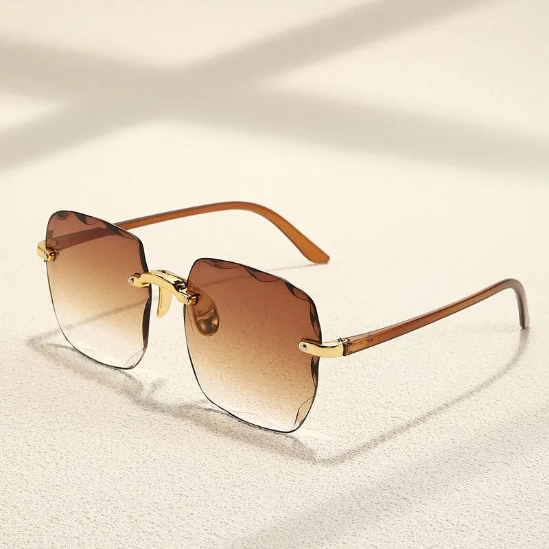 “Square frameless women’s sunglasses with classic gradient lenses.”