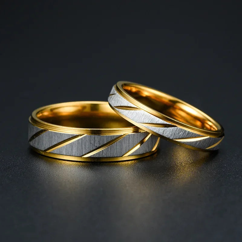 “Gold wave-pattern couple rings, stainless steel, perfect for weddings or promises.”