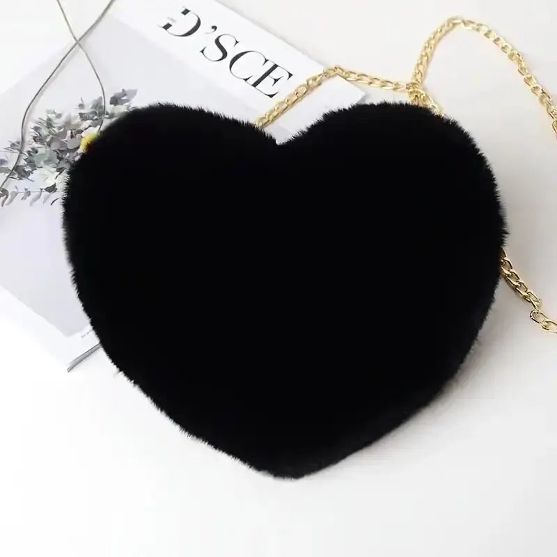“Heart-shaped fluffy handbag, chain crossbody, cute zipper, perfect for Valentine’s Day.”