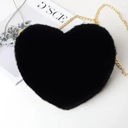 “Heart-shaped fluffy handbag, chain crossbody, cute zipper, perfect for Valentine’s Day.”