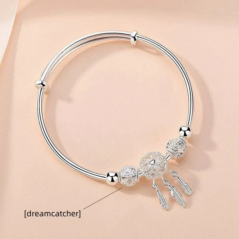 “Silver-Plated Dreamcatcher Bracelet: Elegant Leaves, Tassels, and Beads for Timeless Style.”