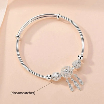 “Silver-Plated Dreamcatcher Bracelet: Elegant Leaves, Tassels, and Beads for Timeless Style.”