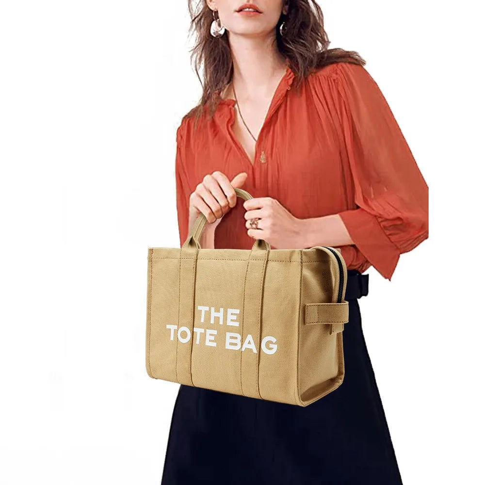 “Designer canvas tote bag, large capacity, adjustable shoulder strap, crossbody style.”