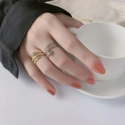 “Gold snake rings, adjustable, punk hip-hop style, stainless steel with zircon details.”