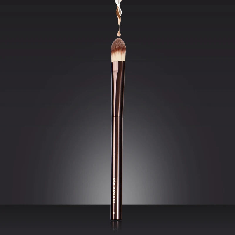 “Large concealer brush, soft fiber hair, flawless coverage, stylish makeup tool.”