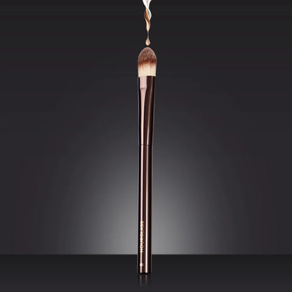 “Large concealer brush, soft fiber hair, flawless coverage, stylish makeup tool.”