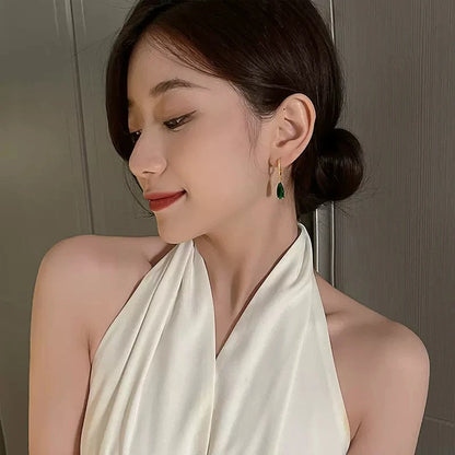“Huitan Pear Green CZ Drop Earrings - Gold Color Luxury Jewelry for Women.”