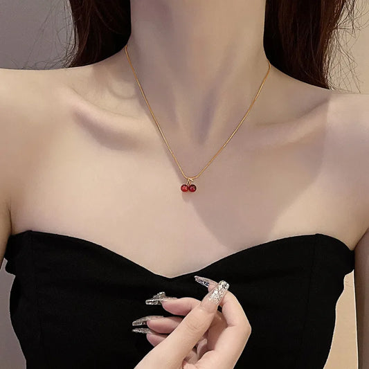 “Stainless Steel Wine Red Cherry Pendant Necklace - Gold Color, Fashion Jewelry for Women.”