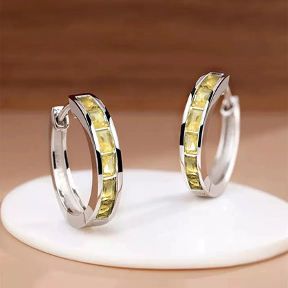“Classic hoop earrings with princess-cut CZ, elegant and versatile women’s accessories.”