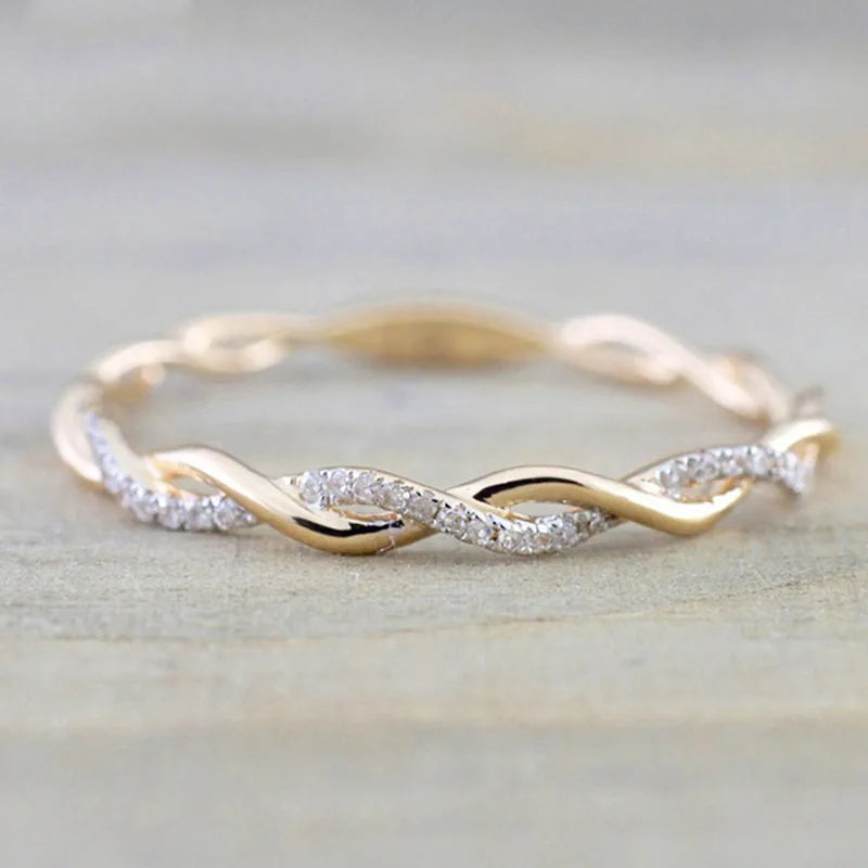 “Huitan Simple Stylish Thin Rings - Twist Band with Shiny CZ for Daily Wear.”