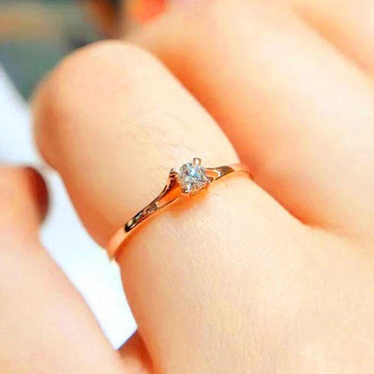 “Minimalist wedding ring with 4MM cubic zirconia, simple and elegant design.”