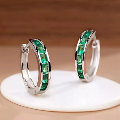 “Classic hoop earrings with princess-cut CZ, elegant and versatile women’s accessories.”